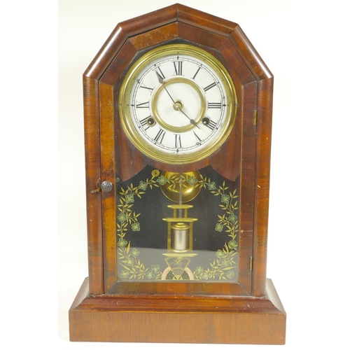 715 - A walnut cased mantel clock with twin train movement striking on a gong, with mercury pendulum, the ... 