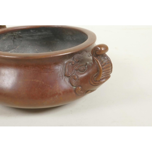 73 - A Chinese bronze censer with two elephant mask handles, impressed mark to base, 5½