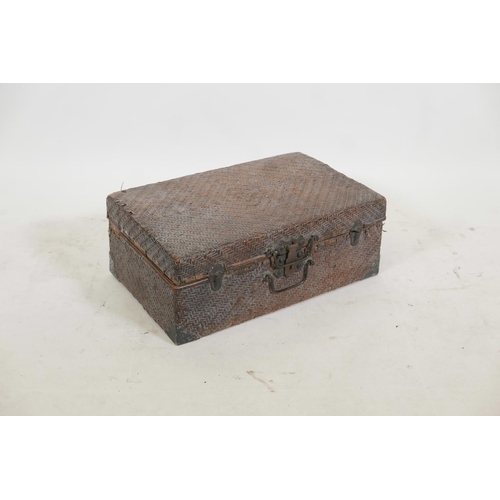 76 - An early C20th Chinese rattan carry case, 19