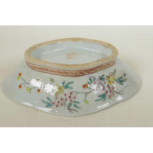 77 - A Chinese lobe shaped porcelain dish painted with flowers and berries in bright enamels, 10