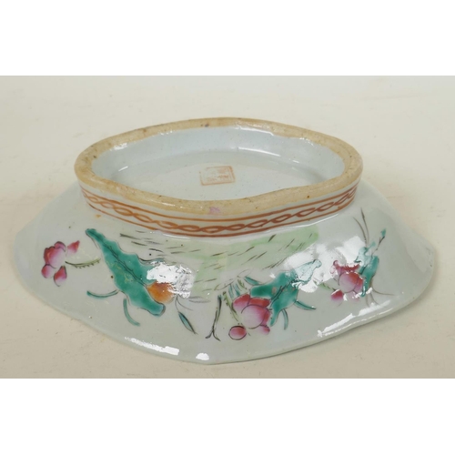 77 - A Chinese lobe shaped porcelain dish painted with flowers and berries in bright enamels, 10