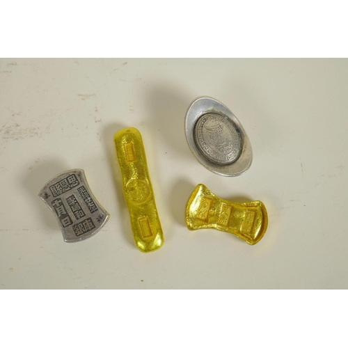 83 - Two Chinese gilt metal trade tokens/ingots, and two similar white metal tokens/ingots, largest 3½