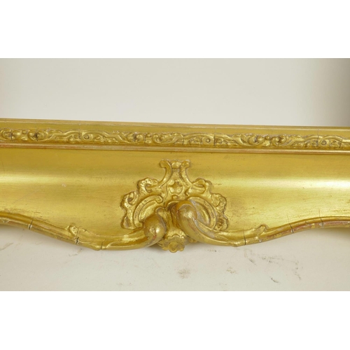 838 - A C19th gilt composition picture frame with C-scroll decoration, rebate 20