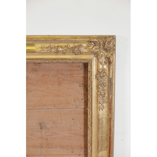 846 - A good C19th gilt composition frame with scroll, leaf and floral decoration, 39