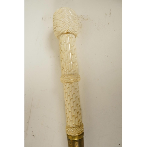 87 - A hardwood walking cane with bone handle carved as wickerwork, 39