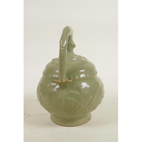 95 - A Chinese Song style celadon glazed pottery oil pourer/pot with raised kylin and floral decoration, ... 