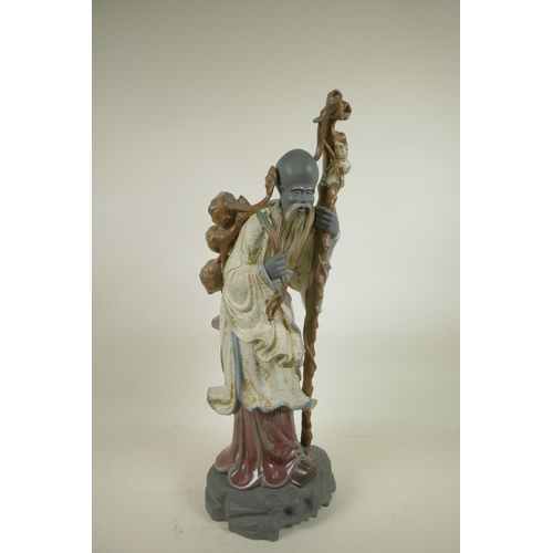 97 - A Lladro figurine of a Chinese farmer (Shao Lao), by Jose Roig, manufactured between 1977 and 1985, ... 