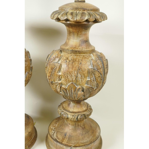 15 - A pair of parcel gilt table lamps carved with acanthus leaves, 21