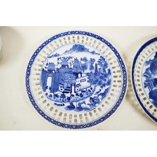 18 - A pair of Chinese blue and white ribbon plates decorated with figures and buildings in a landscape, ... 