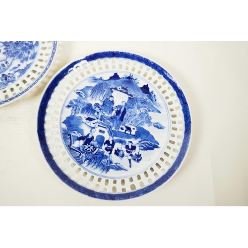 18 - A pair of Chinese blue and white ribbon plates decorated with figures and buildings in a landscape, ... 