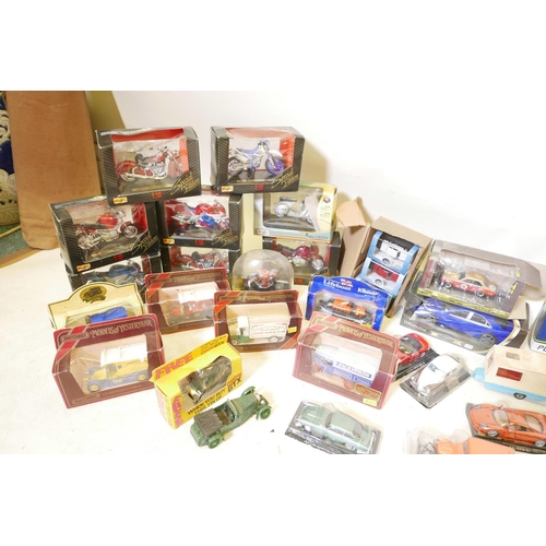 21 - A quantity of scale model cars, commercial vehicles and motorcycles