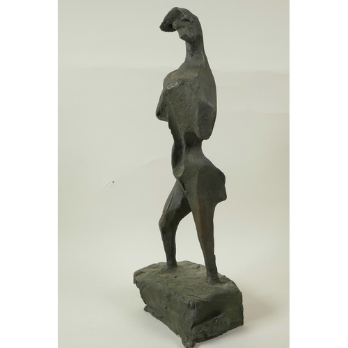 23 - A modernist bronze standing figure on a block plinth base, 17