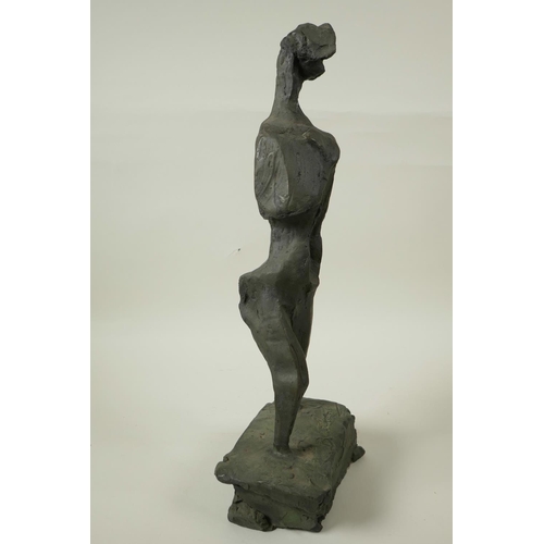 23 - A modernist bronze standing figure on a block plinth base, 17