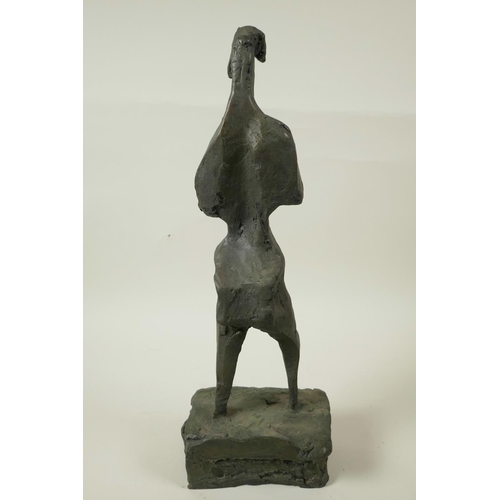 23 - A modernist bronze standing figure on a block plinth base, 17