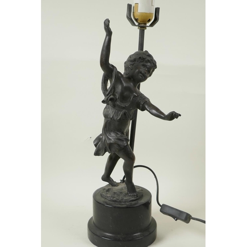 34 - A bronzed metal table lamp cast as a figure of a dancing girl on a plinth base, 17