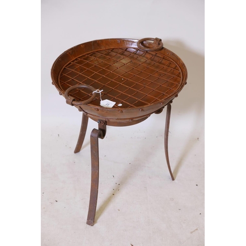 37 - A bowl shaped iron fire pit on wrought iron stand, 18