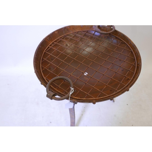 37 - A bowl shaped iron fire pit on wrought iron stand, 18