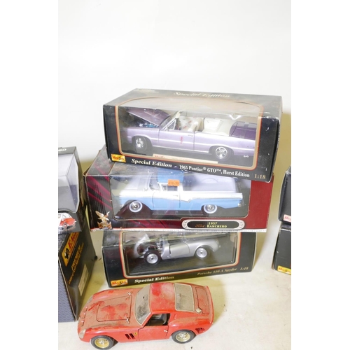 4 - Fourteen 1.18 scale model cars including a Ferrari, Land Rover etc, Eagle, Burago and Maisto, thirte... 