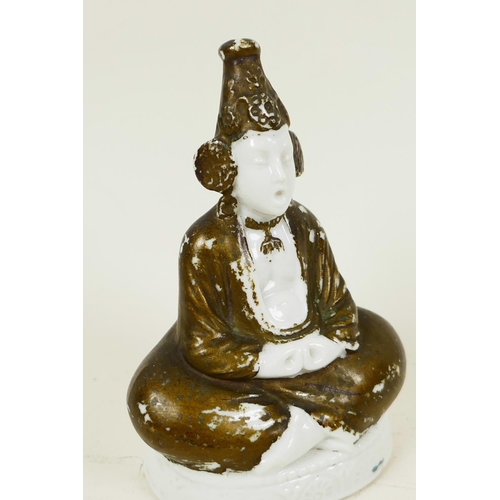 43 - A Continental porcelain pastille burner modelled as a figure seated in meditation, 4