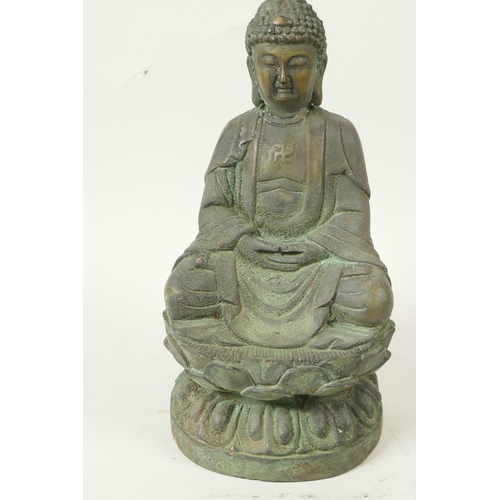 49 - A Chinese bronze figure of Buddha seated in meditation on a lotus throne, having green patination, 8... 