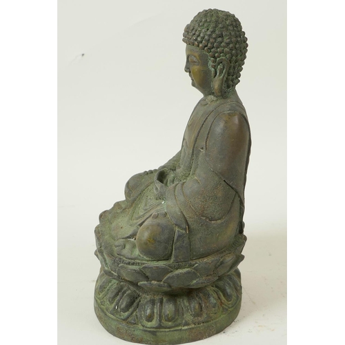 49 - A Chinese bronze figure of Buddha seated in meditation on a lotus throne, having green patination, 8... 