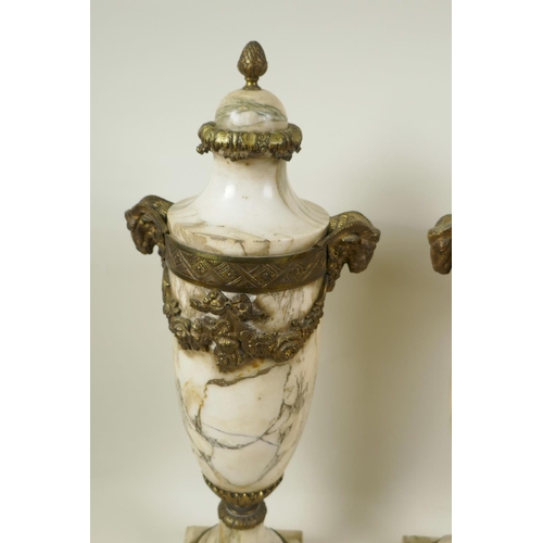 5 - A pair of marble urns with gilt metal mounts and applied garlands, with cast goat mask handles, 18½