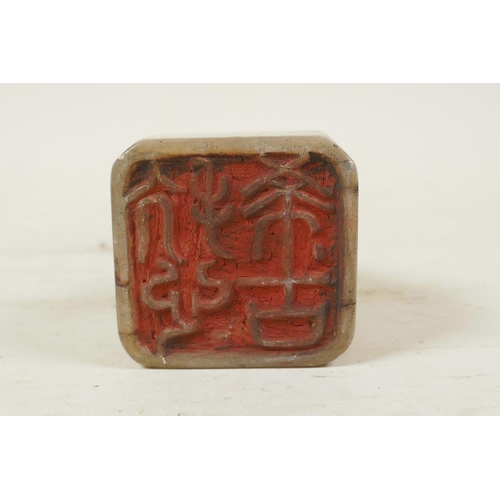 50 - A Chinese soapstone seal with carved dragon knop and character inscription to side, 2