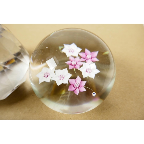 52 - A pink and white florally decorated paperweight, signed, 3