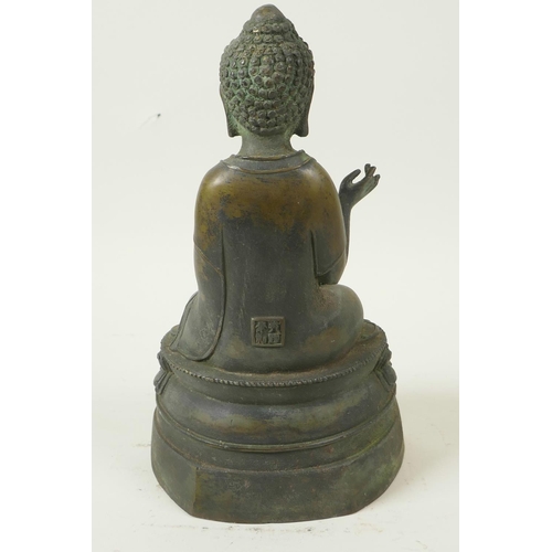 53 - A Chinese bronze figure of Buddha seated in meditation on a lotus throne, seal mark to back, 9