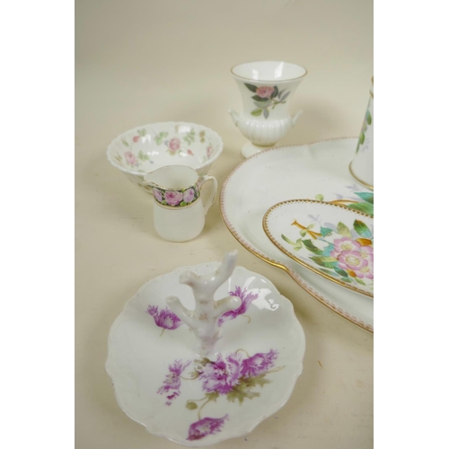 56 - A collection of decorative porcelain including a floral decorated dressing table set, tray 11