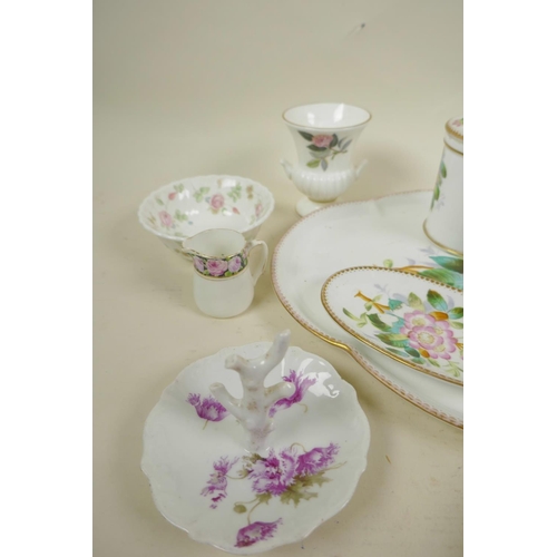 56 - A collection of decorative porcelain including a floral decorated dressing table set, tray 11