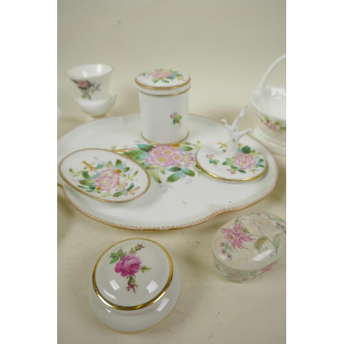 56 - A collection of decorative porcelain including a floral decorated dressing table set, tray 11