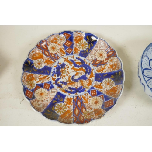 7 - A Japanese Imari plate with lobed edge painted in the traditional palette, 8½