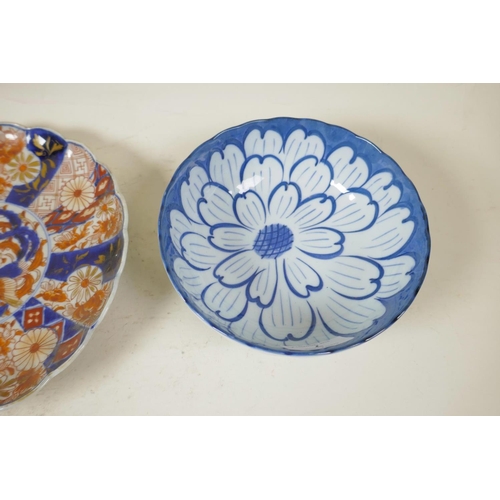 7 - A Japanese Imari plate with lobed edge painted in the traditional palette, 8½