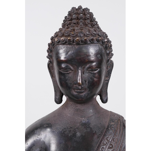 14 - A Chinese bronze figure of Buddha seated in meditation on a lotus throne, holding a small censer, 14... 