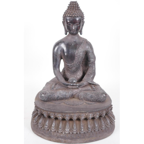 14 - A Chinese bronze figure of Buddha seated in meditation on a lotus throne, holding a small censer, 14... 