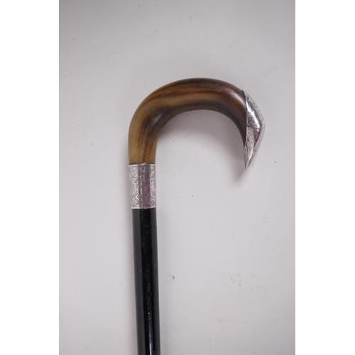 16 - An ebony walking cane with horn handle and engraved hallmarked silver fittings (London 1927), 33