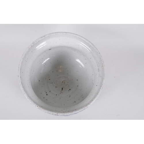 203 - An antique Chinese blue and white porcelain jardiniere decorated with figures in a garden, seal mark... 