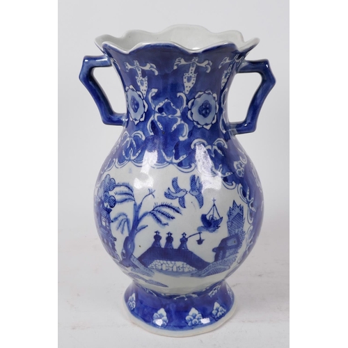 397 - A Chinese two handled blue and white porcelain vase decorated with a variation of the Willow Pattern... 