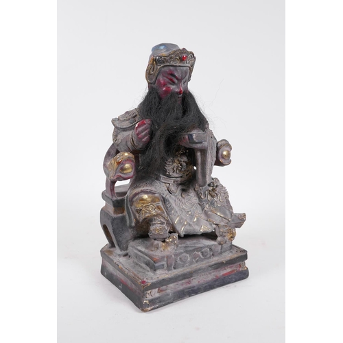 56 - A Chinese carved, patinated and giltwood figure of an emperor seated on a throne, with a human hair ... 