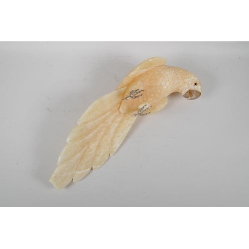 107 - A carved yellow quartz figure of a parrot, 17½