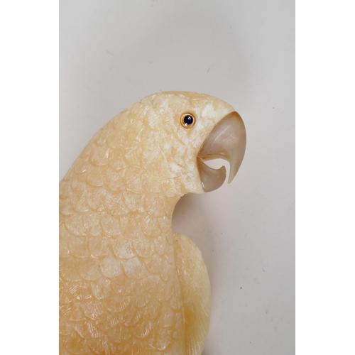 107 - A carved yellow quartz figure of a parrot, 17½