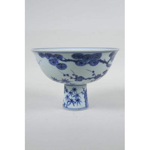 108 - A Chinese blue and white porcelain stem bowl with cypress tree, prunus blossom and bamboo decoration... 