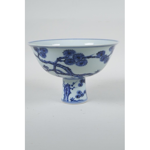 108 - A Chinese blue and white porcelain stem bowl with cypress tree, prunus blossom and bamboo decoration... 