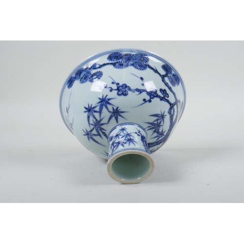 108 - A Chinese blue and white porcelain stem bowl with cypress tree, prunus blossom and bamboo decoration... 