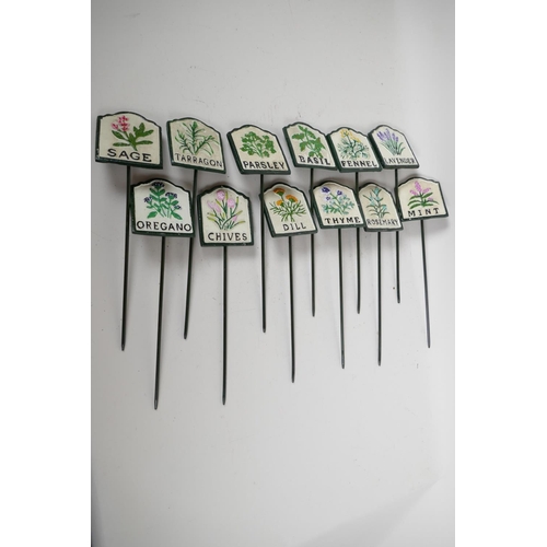 116 - A set of twelve painted cast iron herb garden plant markers, 2¾