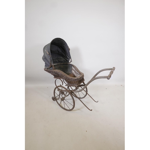 117 - A Victorian wood framed and cane child's pram, 38