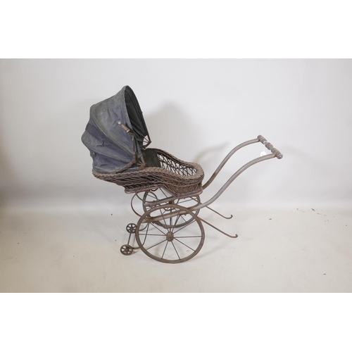 117 - A Victorian wood framed and cane child's pram, 38