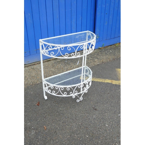 1208 - A painted metal demi-lune two tier garden table, 26