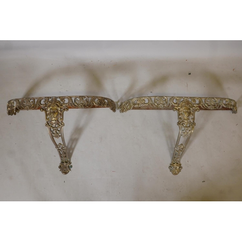 1213 - A gilt brass wall mounted demi lune console table, and another smaller, lack tops, 30